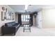 Finished basement with black leather sofa, a treadmill, ceiling fan, and neutral carpet at 3107 Sandhurst Dr, Woodstock, GA 30189