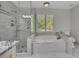 Bathroom with glass enclosed shower and a large soaking tub at 3107 Sandhurst Dr, Woodstock, GA 30189