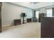 Large primary bedroom with sitting area featuring a neutral carpet and high ceilings at 3107 Sandhurst Dr, Woodstock, GA 30189