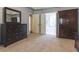 Spacious primary bedroom featuring a neutral carpet and dark wood furniture at 3107 Sandhurst Dr, Woodstock, GA 30189