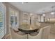 Cozy breakfast nook with a round table, four chairs, and shutters, located adjacent to the kitchen at 3107 Sandhurst Dr, Woodstock, GA 30189