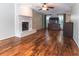 Spacious living room with hardwood floors, a fireplace, and a neutral color scheme at 3107 Sandhurst Dr, Woodstock, GA 30189