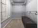 Walk-in closet with custom shelving and a built in bench at 3107 Sandhurst Dr, Woodstock, GA 30189