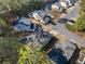 An aerial view of the neighborhood showcasing mature trees and well-maintained yards at 3465 Maple Valley Dr, Cumming, GA 30040