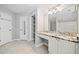 Spacious bathroom with double vanity, granite countertop, closet, and separate toilet area at 3465 Maple Valley Dr, Cumming, GA 30040