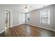 Sunlit bedroom with hardwood floors, double door closet, and fresh paint at 3465 Maple Valley Dr, Cumming, GA 30040
