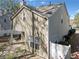 Exterior elevation of a home with a well-kept yard, and quaint patio at 3465 Maple Valley Dr, Cumming, GA 30040