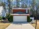 Charming brick home featuring an attached two-car garage and a well-maintained front yard at 3465 Maple Valley Dr, Cumming, GA 30040