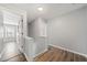 Hallway featuring wood-look floors and neutral-colored walls at 3465 Maple Valley Dr, Cumming, GA 30040
