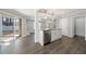 Bright kitchen features stainless steel appliances, granite countertops, and sliding glass doors to outdoor patio at 3465 Maple Valley Dr, Cumming, GA 30040