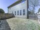 Fenced backyard featuring a lawn, offering privacy and space for outdoor activities at 3822 Harris Nw Blvd, Kennesaw, GA 30144