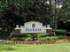 Community entrance sign with lush landscaping, creating a welcoming atmosphere at 3822 Harris Nw Blvd, Kennesaw, GA 30144