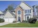 Beautiful two-story home with stone accents, bay windows, manicured landscaping, and a spacious two-car garage at 3822 Harris Nw Blvd, Kennesaw, GA 30144