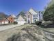 Lovely two-story house with a stone accent wall, a well-kept lawn, and a spacious two-car garage at 3822 Harris Nw Blvd, Kennesaw, GA 30144