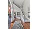 Bright foyer featuring hardwood floors, a soaring ceiling, and a staircase with white railings at 3822 Harris Nw Blvd, Kennesaw, GA 30144