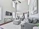Spacious living room boasts high ceilings, an entertainment center, and an open floorplan at 3822 Harris Nw Blvd, Kennesaw, GA 30144