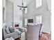 Spacious living room with a fireplace, high ceilings, and a large television at 3822 Harris Nw Blvd, Kennesaw, GA 30144