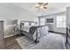 Comfortable main bedroom featuring a tray ceiling, ceiling fan, and lots of natural light at 3822 Harris Nw Blvd, Kennesaw, GA 30144