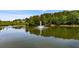 Scenic pond view featuring a fountain surrounded by lush greenery at 3822 Harris Nw Blvd, Kennesaw, GA 30144
