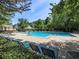 Community pool with ample seating and sun umbrellas, providing a resort-like experience for residents at 3822 Harris Nw Blvd, Kennesaw, GA 30144