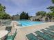 Community pool area with lounge chairs and well maintained landscaping, perfect for relaxation and recreation at 3822 Harris Nw Blvd, Kennesaw, GA 30144