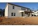 Back of a two-story house featuring a covered patio and expansive windows, great natural light at 456 Maypop Ln, Woodstock, GA 30188