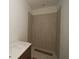 Bathroom with a tiled shower, and a vanity with a white countertop and dark wood drawers at 456 Maypop Ln, Woodstock, GA 30188