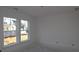 Bright bedroom with double windows offering exterior views at 456 Maypop Ln, Woodstock, GA 30188