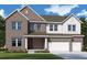New two-story home with brick and siding, complemented by a well-manicured lawn at 456 Maypop Ln, Woodstock, GA 30188