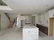 Spacious kitchen featuring a large center island and plenty of cabinet space, next to the staircase at 456 Maypop Ln, Woodstock, GA 30188