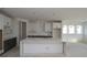 Bright kitchen with a large center island, white cabinetry, and stainless steel appliances at 456 Maypop Ln, Woodstock, GA 30188