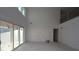 Open living space with soaring ceilings and a view to the second story loft at 456 Maypop Ln, Woodstock, GA 30188