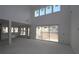 Bright living room with high ceilings and large sliding glass doors offer natural light at 456 Maypop Ln, Woodstock, GA 30188