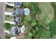 A high angle view showcasing luxury homes with pools adjacent to a lush golf course at 6335 Hampton Creek Dr, Cumming, GA 30041