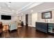 Finished basement area featuring a wet bar, wine cooler, and ample seating for entertaining at 6335 Hampton Creek Dr, Cumming, GA 30041
