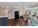 Spacious basement with dark wood floors, windows, kitchenette, and a recreational foosball table at 6335 Hampton Creek Dr, Cumming, GA 30041