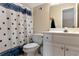 Bathroom with a combination shower and tub and features a blue decorative shower curtain at 6335 Hampton Creek Dr, Cumming, GA 30041