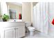 Bathroom featuring a white vanity, toilet, and shower with white curtain at 6335 Hampton Creek Dr, Cumming, GA 30041
