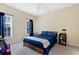 Comfortable bedroom with neutral walls, carpeted floors, and two large windows at 6335 Hampton Creek Dr, Cumming, GA 30041