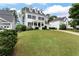 Charming two-story home with a well-manicured lawn and classic black and white design at 6335 Hampton Creek Dr, Cumming, GA 30041