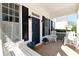 Welcoming covered front porch with rocking chairs, a swing and blue hydrangeas for a cozy feel at 6335 Hampton Creek Dr, Cumming, GA 30041