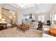 Open floor plan combining the living area, kitchen, and dining room with hardwood floors throughout at 6335 Hampton Creek Dr, Cumming, GA 30041