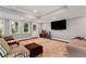 Finished basement with recessed lighting and a large screen TV is perfect for entertaining at 6335 Hampton Creek Dr, Cumming, GA 30041