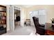 Comfortable home office featuring built-in bookshelves and large windows at 6335 Hampton Creek Dr, Cumming, GA 30041