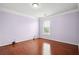 Bright bedroom with hardwood floors and natural light at 810 Abbotts Mill Ct # 83, Duluth, GA 30097