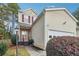 Charming two-story home featuring a one-car garage, landscaped yard, and inviting front porch at 810 Abbotts Mill Ct # 83, Duluth, GA 30097