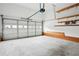 Spacious two car garage with an automatic door opener, and built in shelving at 810 Abbotts Mill Ct # 83, Duluth, GA 30097