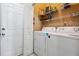 Functional laundry room featuring modern washer and dryer and ample storage shelving at 810 Abbotts Mill Ct # 83, Duluth, GA 30097