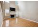 Spacious living room featuring fireplace, high ceilings, and hardwood floors at 810 Abbotts Mill Ct # 83, Duluth, GA 30097