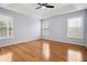 Bright main bedroom features a ceiling fan, trey ceiling, and multiple windows letting in plenty of light at 810 Abbotts Mill Ct # 83, Duluth, GA 30097